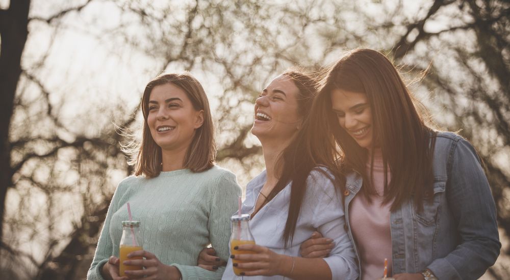 three women laughing 